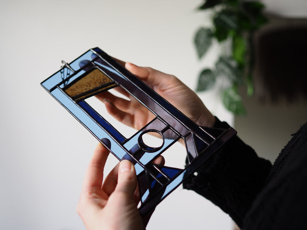 Guillotine 'Eat The Rich' blauw glasraam